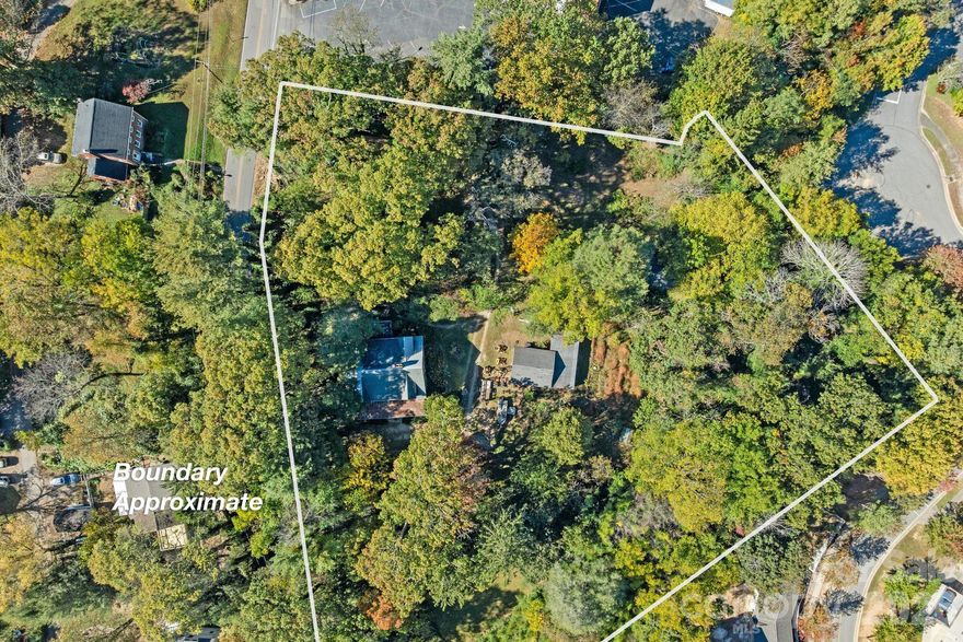 Prime RM-6 Development Opportunity in Kenilworth – 2.23 Acres with Vintage Home

Unlock the potential of 2.23 acres in Asheville’s highly desirable Kenilworth neighborhood, zoned RM-6 for medium-density residential development. This rare in-town parcel offers multiple paths to value (buyer to verify): subdivide for townhomes or cottage clusters, establish a tiny home community, or restore the existing 1927 brick Arts & Crafts residence as a family home or boutique bed & breakfast.


The existing home features original wood floors; built-ins; vintage windows; a deep, red ceramic tile front porch; and a second-story flex space with sink, range, and mini-fridge—ideal for guests or creative use. With Beaucatcher Road frontage, sewer access, and privacy in a central location just minutes from downtown Asheville, Mission Hospital, and Biltmore Village, this property offers both immediate utility and long-term upside. This property is ideal for developers, investors, or visionaries seeking a blend of classic charm and urban scalability.
