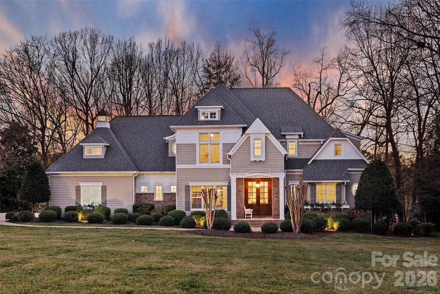 There are homes that impress — and homes that move you. 127 Heathand Lane in The Point does both.
Built by Kingswood Custom Homes and set on a premium golf course lot on the 13th green of TNCCC with breathtaking year-round water views, this extensively renovated, move-in-ready luxury residence features refined architecture, designer finishes, and exceptional indoor-outdoor living in one of the area’s most prestigious communities.
A comprehensive 2017 main-level renovation transformed the heart of the home, including the chef’s kitchen, breakfast room, wine alcove, laundry room, drop zone, and powder bath. The open-concept entertainer’s kitchen features Monogram appliances, a six-burner gas range with griddle and double ovens, a cabinet-paneled refrigerator, dual refrigerator drawers, granite countertops, an oversized island with seating and two refrigerator drawers, a farmhouse sink, an appliance cabinet/coffee station, and a butler’s pantry with leathered granite and a built-in ice maker. Custom cabinetry and floor-to-ceiling storage blend elegance with functionality. A custom wine alcove with built-in shelving and a U-Line wine cooler completes the space.  
Architectural details include cherry hardwood floors, heavy crown moulding, plantation shutters, rounded wall corners, solid-core wood doors, and custom millwork throughout. The living room centers around a vented stone fireplace with built-ins and a shiplap accent wall, while the formal dining room showcases refined mouldings ideal for entertaining.
The luxury primary suite offers direct access to the covered porch and panoramic views of the golf course and water. The spa-inspired bath, fully renovated in 2020, features heated tile floors, dual quartz-topped vanities, a deep-soaking tub with built-in shelving, an open-concept shower with a bench, a private water closet, and two walk-in closets.
Upstairs features three spacious bedrooms with newly renovated en-suite baths (2026) showcasing marble countertops, new vanities, designer tile surrounds, updated lighting, fixtures, mirrors, and new toilets. A large bonus room provides flexible recreation space, and the private executive office/Den includes cherry floors, built-ins, a gas fireplace, and breathtaking lake views.
Outdoor living is exceptional, with a covered porch featuring a wood-burning stone fireplace, a built-in ceiling heater, stone flooring, a wood-accented ceiling, and removable wind panels for year-round enjoyment. A lower patio with a built-in wood-burning fire feature enhances the resort-style atmosphere.
Major capital improvements include a new roof (2020), a fully encapsulated crawl space by DryPro (2018), and Trane HVAC systems on both levels (2018 & 2022), each with a warranty, providing energy efficiency and long-term value.
Boat slip Z-Dock, slip 33, with a boat lift is included (an ideal location at Z-dock).
Luxury, privacy, panoramic views, and turnkey updates — this is elevated golf course/lake living at its finest.