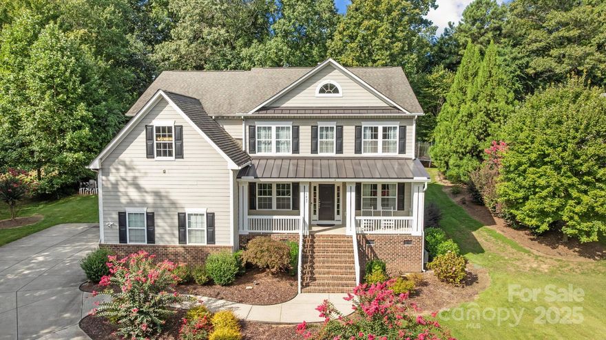 An extraordinary opportunity awaits in Fort Mill’s coveted Tara Plantation—a custom home on nearly three-quarters of an acre in an established neighborhood, ideally located just minutes from shopping, I-77, and top-rated schools. Tara Plantation is a community full of Southern charm, where  tree-lined streets create a welcoming sense of home. 1463 Old Tara Lane captures that spirit perfectly with its oversized front porch—an ideal spot for rocking chairs and sipping sweet tea while enjoying the quiet surroundings. This home truly shows like a model home with upgrades throughout, including custom light fixtures, shiplap accent walls, LVP floors, crown molding, arched entryways, and wainscoting in the foyer and formal dining room—no detail has been overlooked. The open floor plan features a gourmet kitchen with custom cabinetry, tile backsplash, double wall ovens, gas cooktop, oversized island, and a stunning picture window over the sink overlooking the private backyard and serene in-ground pool. The kitchen flows seamlessly into the great room with gas fireplace for cozy nights. A private first-floor guest suite with full bath, formal dining with butler’s pantry, walk-in pantry, and mudroom with custom built-ins add convenience and elegance.
The primary suite is a true sanctuary with a sitting room or private office, spa-like bath with soaking tub, walk-in rain shower, dual vanities, and a large walk-in closet with custom system. Upstairs also includes a large bonus/family room currently used as a gym, a guest bedroom with private bath, and two additional bedrooms connected by a Jack & Jill bath, along with a second-floor laundry. 
Step outside to enjoy the resort-style backyard with pool, hot tub, and screened in patio with access to half bath- no more wet feet in the house! The pool features a Nature2 Fusion mineral sanitation system that uses natural minerals to reduce the level of chlorine needed, providing cleaner, softer water with less chemical use.
Professional landscaping for the ultimate in privacy.
Additional features include an oversized three-car garage, tankless water heater, Ring security system, and fully encapsulated crawlspace. This home blends luxury, comfort, and function, offering the perfect retreat for everyday living and entertaining.