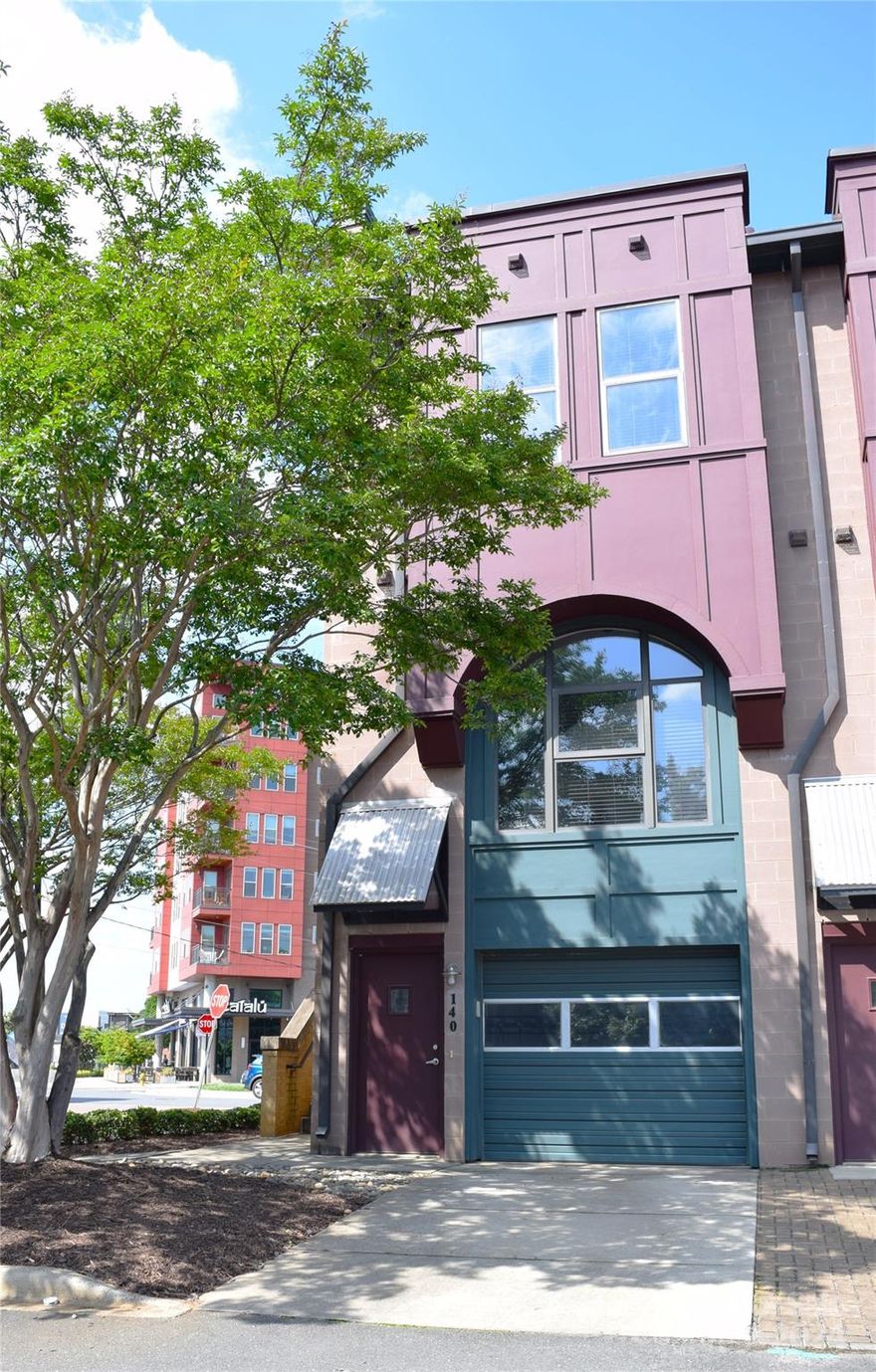 Must see 4 story townhome w/ PRIVATE rooftop terrace in South End. This end unit is one of bigger townhomes in the complex. 1st level features a 1 car garage w/ storage closet & large office/bonus room w/ a separate entrance - zoned commercial for light office use. Main level is an open layout living room, dining area, & kitchen w/ beautiful hardwood floors. Updated kitchen w/ granite countertops, stainless steel appliances, modern cabinets w/ glass inserts, & modern fixtures. Conveniently located half bath on main level. 3rd level has 2 spacious bedrooms, each with their own private bathroom & walk-in closet. Full sized washer/dryer included. 4th level leads to a huge private rooftop (200 sq feet) - perfect for entertaining or relaxing after a long day. You can't beat this location - located steps away from the New Bern light rail station. Walk to dozens of restaurants, bars, breweries, shopping, & the grocery stores.