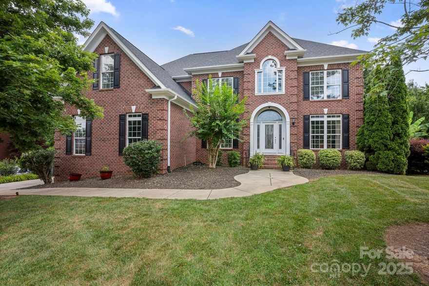 Resort style home located in Fort Mill. Heated Dive Pool, Designer Finishes Full Brick & Excellent Schools 
Stunning Home that is freshly painted and fully remodeled gourmet kitchen adorned with rich cabinetry, stainless steel appliances, a spacious quartz island, and a walk-in pantry.
A dual staircase with oak and wrought iron railings leads to a catwalk overlooking the soaring two-story great room and grand foyer. The main level includes a private guest suite ideal for multigenerational living or luxury hosting.
Upstairs, retreat to your expansive owner’s sanctuary with a completely remodeled spa-inspired bathroom showcasing designer porcelain tile, striking Moen Gold fixtures, an oversized walk-in shower, and a freestanding modern soaking tub that invites relaxation.
The unfinished basement offers limitless potential.
Step outside to your own private resort: a tranquil, wooded backyard with heated diving pool—designed for both serenity and year-round entertaining.