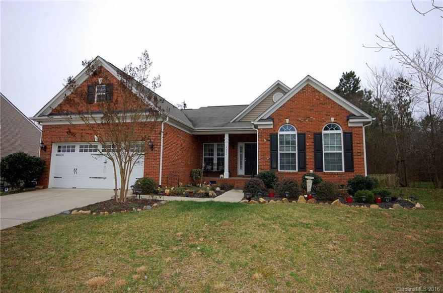 Great Ranch home with fabulous sunroom and large wooded, fenced yard. You'll love the open concept from the great room with gas fireplace to the kitchen with tons of counter space, gas range, and attached breakfast area. The master bedroom features a tray ceiling, while the master bath boasts a garden tub, separate shower, and double vanity.  Hardwood flooring and surround sound throughout! Deck out back for entertaining and private yard complete this package. Great location close to the lake.