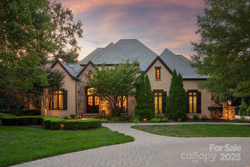 Showings begin Friday 9/5!  Nestled on a private, wooded 1.22-acre lot in the prestigious gated community of Longview Country Club, this custom basement home offers the perfect blend of elegance and comfort. Designed for entertaining, the backyard is a true retreat with a sparkling pool, spa, cabana, and putting green. Inside, recent kitchen enhancements, custom wainscoting, and stylish new lighting bring a modern touch to the timeless design.

The main-level primary suite features heated floors, spa-like bath, generous walk-in closet, and direct access to a screened and covered porch—ideal for morning coffee or quiet evenings. A private study with French doors provides a warm and functional workspace, while an elevator ensures easy access to main and basement levels.

The finished basement is an entertainer’s dream with a double-sided fireplace, billiards room, second full kitchen, expansive guest suite, and dedicated golf cart storage. Upstairs, you’ll find spacious secondary bedrooms, a versatile bonus/media room, and abundant walk-in storage. Additional highlights include a full pool bath with exterior access, whole-home water filtration, and a three-car garage.