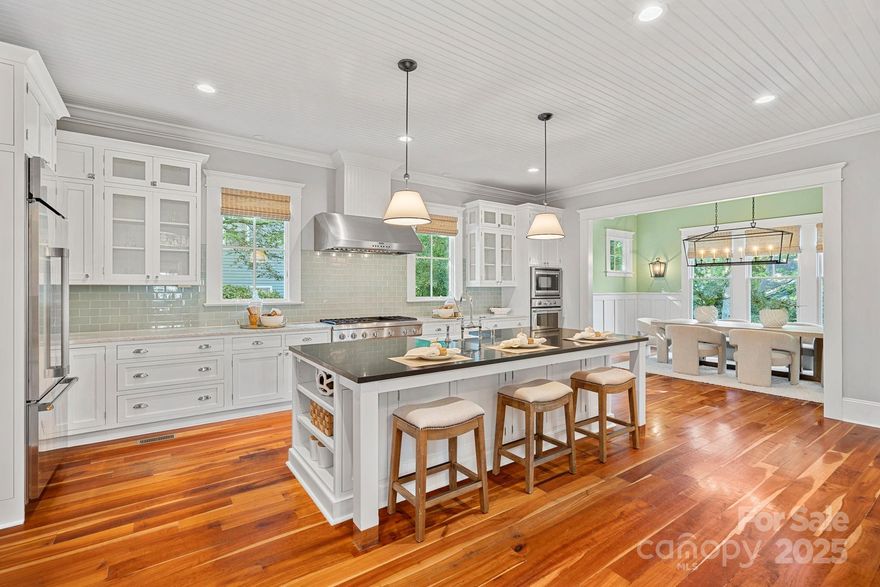 Rare opportunity to own a John Marshall Customs Homes style farmhouse nestled in the heart of Davidson...one of North Carolina's most sought after towns.  A rare blend of timeless design and modern luxury.   Near 4,400 sq ft of thoughtfully designed living space featuring exquisite architectural details.  They do not build them like this anymore- 5" solid cherry wood floors, the artisan millwork throughout, solid wood shaker style interior doors, solid mahogany exterior doors.  Gourmet kitchen with a large center island and Thermador appliances all open to the vaulted ceiling dining room. Entertainers dream! Back yard surrounded by lush gardens, mature crape myrtles, and patios for days.  Studio apartment  completed in 2019 at the same design level.  Use  as a guest suite, private office, multi-generational retreat, or as an income producing opportunity. Just steps from Davidson's vibrant shops and restaurants offering a lifestyle of sophistication, convenience and community.  And you can have a pool.  The Town of Davidson says so...in writing.