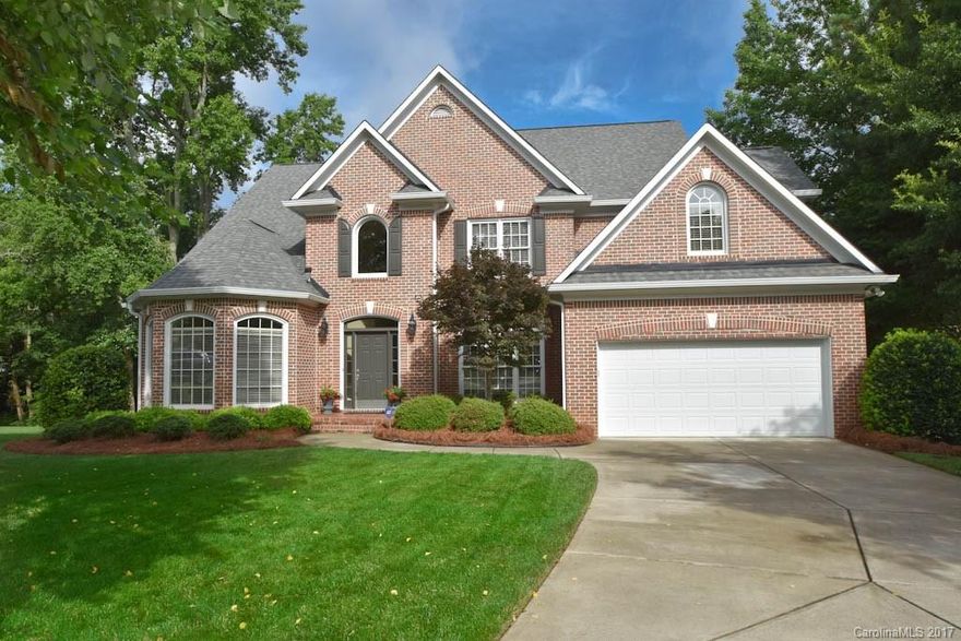 A rare find! 3 sides brick, master suite on main,  large great room with raised ceiling, great kitchen with granite tops and tile backsplash, lots of hardwood floors, main level office or living room, 3 BRs up plus a bonus room and lots of storage!  Private, wooded lot on a quiet cul de sac, screened porch plus a deck and a paver patio! Great condition, clean and well maintained!