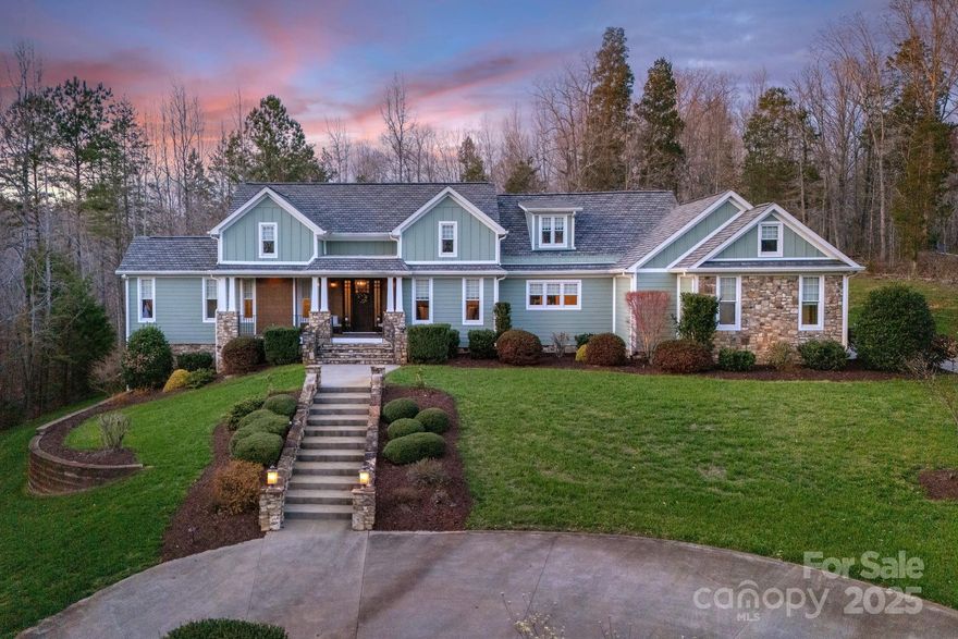 Welcome home to 1426 Merrimont Avenue! This home is situated on a private two acre lot that offers seclusion yet easy access to I85. 1426 Merrimont offers main floor living and a beautiful open concept perfect for entertaining. This home has a spacious kitchen with beautiful granite counters & lots of storage for the most discerning chefs. The living room offers a warm and inviting fireplace with built-ins for added storage. The primary bedroom includes a picturesque sitting room and a generously sized bathroom and walk in closet. The cozy screened in porch includes a wood burning fireplace that allows entertaining year round! This beautifully appointed home also offers a second primary bedroom on the main floor with a sizable walk in closet and full bath.The lower level boast two expansive bedrooms, dreamy second kitchen, bonus room with handsome stone fireplace, and two large storage rooms. Let the serenity of this beautiful home and well appointed lawn welcome you to your own oasis.