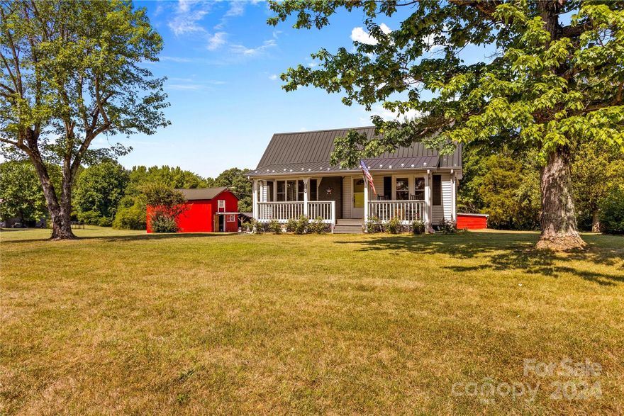 This charming 3 bed, 2 bath home sits on 4.36 acres of beautiful land and is the perfect opportunity for a homestead! Updates galore! fresh paint inside and out, refinished gleaming hardwood floors, kitchen backsplash, plumbing, electrical, fixtures, and sliding door in bedroom suite. The back deck overlooks yard and multiple structures on the property. Tobacco barn and 24x30 metal garage/workshop with air compressor are both wired for electricity. Attic with fixed stairs provides tons of extra storage space. Convenient to major interstates.