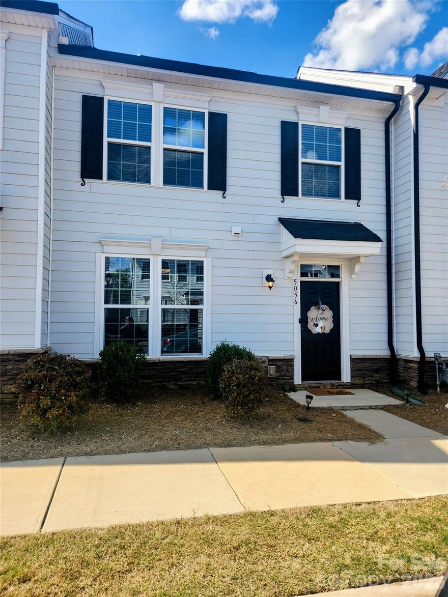 This modern farmhouse-style townhome built in 2020, offering low-maintenance living with high-end upgrades throughout. This 3-bedroom, 2.5-bath home features a private courtyard with a lawn, privacy fencing, patio pad, and gas line for grilling. The 2-car garage is located in the rear, with additional street parking in front. Inside, enjoy an open floor plan with abundant natural light, large open plan kitchen to dining and living rooms. Upstairs, the spacious primary suite includes a walk-in closet and en-suite bathroom. Laundry is conveniently located upstairs with additional storage space. Two more generously sized bedrooms and a full bath completes the upper level. Other features include 9' ceilings on both floors, smart home features, and a tankless water heater. All appliances stay! Move-in ready!