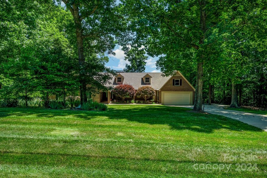While the term “One-of-a-Kind” is overused, this is a genuinely unique property! Start in the back with 150’ of lake shoreline, dock, seawall & stairs for easy water access; Stroll across the open yard full of mature trees & landscaping to the custom built home; This floor plan has something for everyone -- HUGE kitchen, open great room w/wood burning fireplace, bright sunroom w/gorgeous views, primary suite w/French doors leading to a screen porch that stretches 62’ across the back, oversize secondary BR’s, large laundry/mud room, open loft w/sitting area, bonus/2nd primary w/full bath & gas fireplace, AND a basement perfect for just about anything; Need storage? Unfinished area in the basement has double exterior doors, enclosed room in the garage, & two enclosed storage areas accessible from the covered patio; Low-E energy efficient windows, heat reducing radiant barrier in the attic, water filter/softener system, termite bond, & two water heaters; Must see to appreciate everything