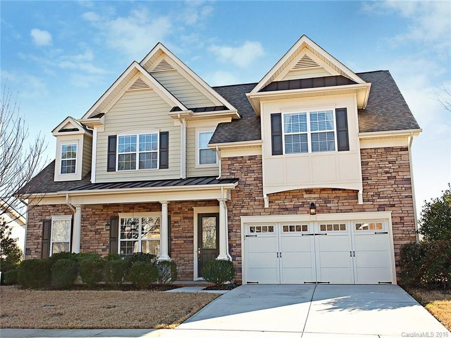 Here's the Curb Appeal Your After! Stone, leaded glass door, stylish garage door, & lush lawn. Nestled in a friendly neighborhood with a playground, airnasium and pool. Home features: open floor plan, wainscoting, columns, tray & vaulted ceilings, gas fp, open upper staircase. Full laundry, attic access & lots of closets. Spacious Kitchen with pantry, bkfst bar, SS, granite & tile backsplash. Luxurious Master w/ garden & shower, lg walk-in. 5 BD or 4 BD Play/Rec Room? Perfect location near I-77!