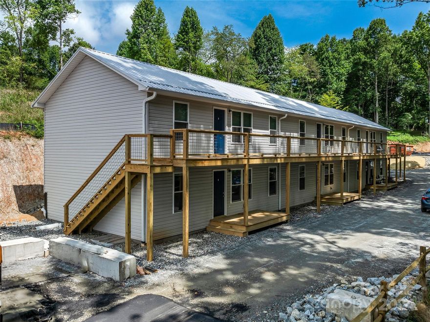 Brand new construction, fully leased six-unit apartment complex in Mars Hill. Each of the 878 SF units features a  modern 2 bed, 2 bath layout and private parking for Tenants. Perfectly positioned in a rapidly growing area near Mars Hill University and just minutes from I-26, this property offers unbeatable convenience for tenants and a golden opportunity for investors. With high demand, limited rental supply, and an estimated 7% cap rate, this property promises substantial returns and smart savings, thanks to low holding costs from its septic system, well water, and county location. It's not just a property—it's your gateway to investment success. Assisted showings only, no drive-bys. For more details, check out our brochure in the attachments. Listed as Multi-Family Sale, MLS# 4168133