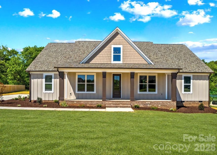 Home is now done! Custom 1.5-Story Modern Farmhouse with 3-Car Garage –This beautifully crafted home offers today’s living with an open, light-filled floor plan designed for both everyday comfort & elegant entertaining. Featuring 4 spacious bedrooms, a private office, & a bonus family room. The home provides exceptional flexibility for modern lifestyles. At the heart of the home is a dream gourmet kitchen showcasing a stunning oversized quartz island, stainless steel appliances, tile backsplash, and a generous walk-in pantry. The spacious Den features custom built-ins, a stylish shiplap accent wall, and an electric fireplace, creating a warm & sophisticated living space. Throughout the home you’ll find 9-foot ceilings, luxury LVP flooring, & elegant tile finishes. Step outside to enjoy 304 square feet of covered patio space, ideal for outdoor dining and entertaining. The 3-car garage and double driveway provide abundant parking and storage. The luxurious main level primary suite offers a peaceful retreat complete with an extra-large 13’ x 9’ walk-in closet and spa-like comfort bath with a tiled Shower & modern Roman soaking tub. Guests are welcomed by a charming Huge covered rocking chair front porch. Perfectly positioned on the border of Mooresville and China Grove. Minutes to Highways 150, 152, I-85, & 29. Enjoy nearby parks, the Y with indoor pool and fitness facilities, and three golf courses within 10 minutes. Lower utilities cost with Duke Energy & a new well and septic. Designed for gathering, entertaining, and comfortable luxury living, this exceptional home truly stands apart. Rare to get a 3 Car Garage & the covered outdoor living spaces. Home is partially staged & also virtually staged.