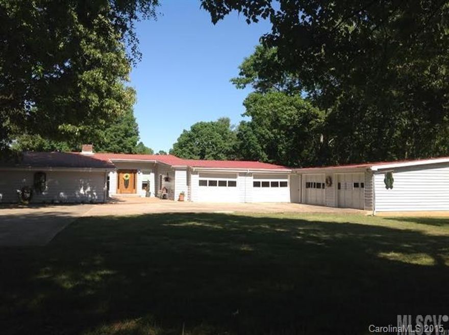 4BR/3.5BA w/POOl & 4 CAR GARAGE w/grease pit on 3.25 acres. Main: Updated kitchen w/Granite counter, beautiful SS appliances, tile floor, open concept living room w/fireplace, Large Sunroom, Laundry Room, Large Master Br/w spacious Master Bath including: Tile, glass blck/tile shower, double sink vanity. /lower: Den w/fireplace & tile floors, spare room w/closet & full bath & full bath w/double sink vanity, access to pool.Call for your private tour today!