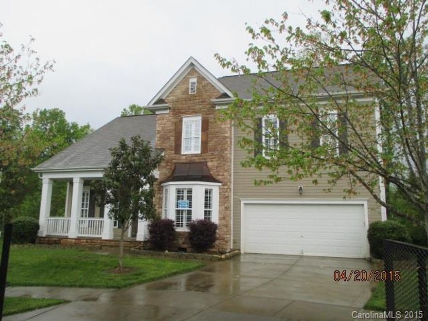 A must see! Beautiful 5 bedroom, 3.5 bath partial stone home in Water Oak Subdivision features nice kitchen with ample cabinet spaces, formal dining room with wainscoting, and living room with fireplace. Features include some wood floors, bay windows, master on main, sun room, porch, deck, and 2 car attached garage. Home sits on cul-de-sac lot where the back yard borders a small inlet of the lake and has lots of trees. Set a showing now and make this your new home!