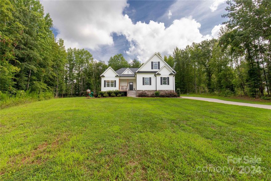 Welcome Home to 2615 Moon Creek Ln. This beautiful secluded cul-de-sac lot is ideally situated and offers 1.49 acres of space to spread out. The home features 2188 sq ft of living space thoughtfully arranged over 1.5 floors. The upstairs is a bonus room with a convenient half bath. The main level offers a gorgeous Kitchen, living space, dining room, two guest rooms, and the primary suite! The open concept of the living space/kitchen/dining room is perfect for gatherings where everyone can feel included! The Kitchen also boasts a generously sized work island. The split floor plan with the 2 guest rooms on the left and the primary suite on the right, is just the right amount of privacy! The primary bedroom showcases an accent wall, an en-suite bath with dual vanities, a large tile shower, and dual closets. Outback you'll find a fenced-in yard, covered deck, and ample privacy! This one has it all!