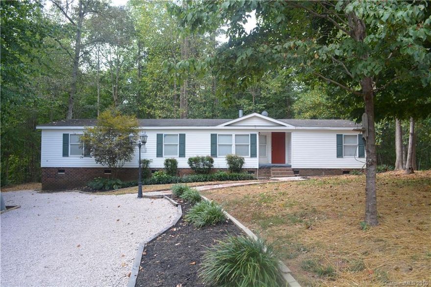 In the heart of NASCAR Country sets this completely remodeled home.  Enjoy this private wooded oasis at the end of a cul-de-sac.  The beautiful home includes stainless steel appliances, granite countertops, storage building, new landscaping including driveway and much more.  Conveniently located between I85 and I77 with easy access to Concord Mills or Lake Norman via 150 or George Liles Parkway.  Mooresville address with Rowan County taxes.