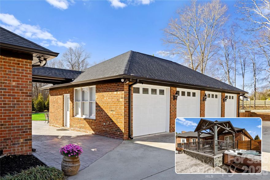 Set on a private one-acre lot in Concord’s established Carolando community, this impeccably maintained brick ranch offers a rare blend of privacy, functionality, and thoughtful upgrades. A standout feature is the expansive driveway that leads to an amazing brick four-car 1287 sq ft heated and cooled garage, enhanced with upgraded LED lighting, interior water spigot with floor drain, multiple 220V outlets suitable for equipment, wall-mounted electric pressure washer, plumbed air drops, fresh paint, and attic storage. An air compressor is housed separately in its own dedicated shed.

The interior features a bright, open floor plan with refinished hardwood floors in the main living areas, smooth ceilings, fresh paint, updated bathrooms, and curated modern lighting throughout. A dedicated fitness space with commercial-grade flooring includes plumbing stubbed along the driveway wall beneath the flooring, originally designed for a future kitchenette. Electrical outlets are installed at counter height behind mirrors, and a butler’s pantry cabinet is plumbed for an additional washer and dryer.  Giving this space a wonderful opportunity for multigenerational living.  

Outdoor living is elevated by a multi-level raised stamped-concrete patio with upper and lower entertaining areas, a covered pavilion, hot tub, and professionally designed landscaping and tree work that enhances privacy. The level one-acre lot provides generous space for parking recreational vehicles, trailers, and guest vehicles. No mandatory HOA.

Extensive improvements completed between 2021–2025 include a new HVAC system (2021), roof and gutters (2022), and numerous interior and exterior enhancements, contributing to a move-in-ready experience.

Conveniently positioned near Concord’s expanding business corridor home to Cadillac F1, Red Bull, and Eli Lilly . On race days, the excitement from the Charlotte Motor Speedway can heard off in the distance.