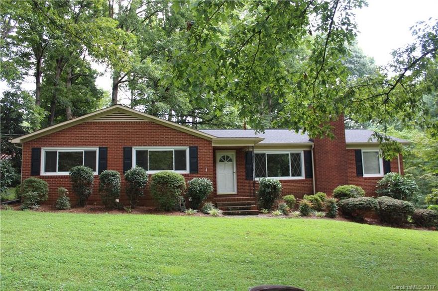 Great House all Brick, beautiful lot over 1 acre! Desireable East Iredell Location! Convenient to shopping. This house has so much great living space, hardwood floors like new, freshly painted,very nice kitchen, full sized bedrooms, stainless appliances, huge basement with second kitchen , access to outside, rec room, workshop, den with built ins could be office, Must see! Pool, tennis, Golf optional with membership options.