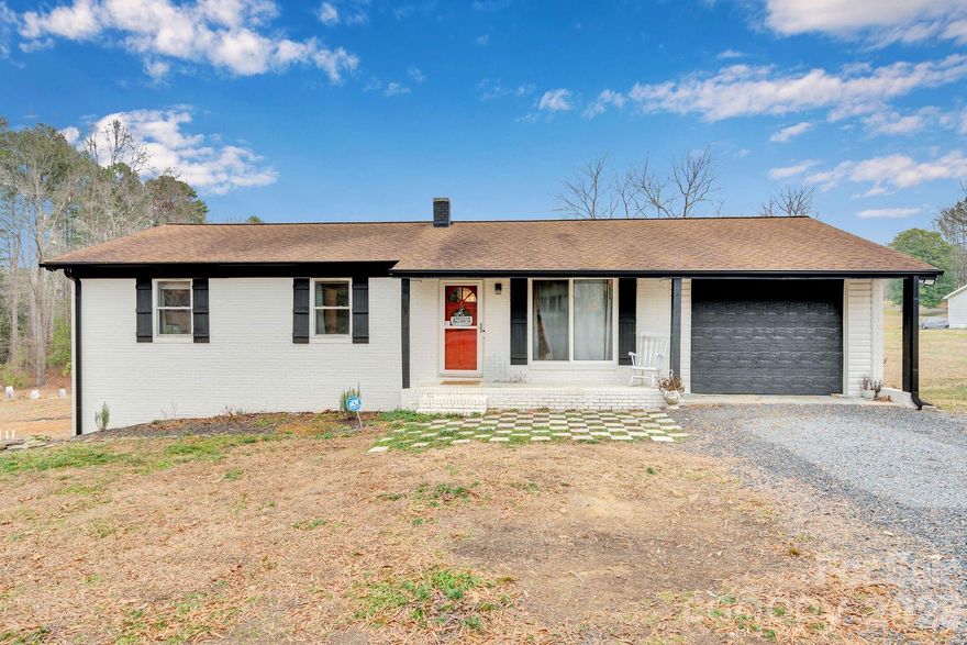PRICE DROP!! MOTIVATED SELLER!! UPDATED FEATURES!! Welcome home to this classic 3 bed 2 bath, full-brick ranch sitting on a peaceful 1+ acre lot in the heart of Stanly County! Tucked along a quiet country road with no HOA, this property offers the space, privacy, and simplicity every one is looking for while still being just a short drive to town.

Inside you'll be greeted with an easy-flow layout that makes everyday living feel natural and inviting. The double-pane windows bring in plenty of natural light, giving the home a warm, welcoming feel from the moment you step inside. Sellers have made numerous updates and improvements to the home! 

Downstairs, the large basement adds incredible versatility, complete with a second side-entry garage perfect for a workshop, storage, hobbies, or future expansion. Whether you need room for tools, toys, or projects, this space delivers.

RECENT IMPROVEMENTS-
New drain line and drain field, sellers just had fiber optic lines ran to the house, new deck, updated flooring, etc.