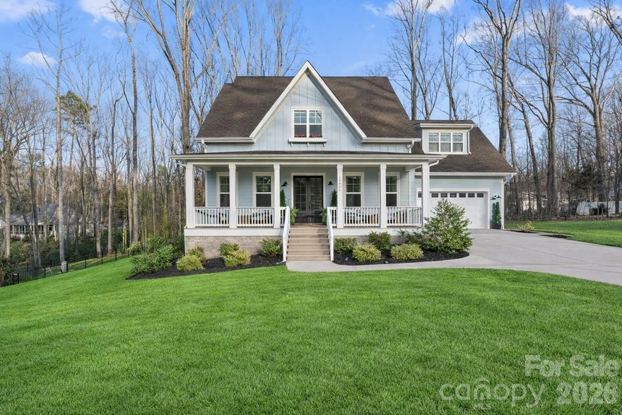 Exceptional craftsmanship and custom design finishes define this beautifully appointed home; set on a private half-acre lot with no HOA, offering the perfect escape from busy city living.
A spacious covered front porch welcomes you in, while the screened rear porch creates an ideal setting for quiet mornings, relaxed evenings, or effortless entertaining surrounded by space and privacy.
Premium laminate wood flooring begins at the double-door entry and flows throughout the main level. The open-concept floor plan centers around a stunning living area with gas fireplace, seamlessly connecting to the dining space and designer kitchen. Quartz countertops, a herringbone tile backsplash, KitchenAid appliances, a generous island with seating, and a walk-in pantry complete with appliance counter make this kitchen both functional and refined.
The primary suite is conveniently located on the main level and features board-and-batten detailing, a beautifully crafted bath, and a spacious walk-in closet. A thoughtfully designed service hall includes a laundry area, powder room, drop zone, and access to the rear porch and oversized double garage.
Upstairs, two secondary bedrooms offer walk-in closets (one with a private bath) while the hall bath serves the fourth bedroom and versatile upper-level spaces including a rec room & dedicated office area.
With generous outdoor space, freedom from HOA restrictions, and a layout designed for both comfort and entertaining, this home delivers privacy, flexibility, and everyday livability - all while remaining convenient to the city when you need it (bonus: without paying Charlotte city taxes). Easily accessible to all surrounding Charlotte submarkets, just minutes from I-485.