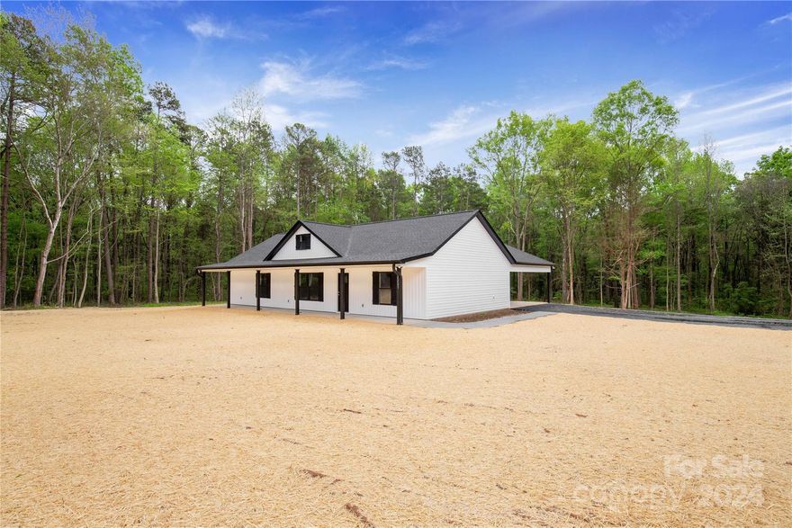 Check out this beautiful new construction home on 3.29 acres located in York outside of city limits! This home boasts white vinyl siding with contrasting black windows and a spacious attached two-car carport. Inside, the main living space and kitchen have an open and inviting layout. The kitchen features white cabinetry, granite countertops, and stainless steel appliances. The main living areas have LVP flooring and alabaster walls on a split floor plan. The primary suite includes an en suite with tile flooring and a tile shower. On the other side of the home, two guest rooms share a full bathroom. Don't wait, this amazing home won't be available for long!

*PHOTOS ARE RENDERINGS ONLY NOT OF THE ACTUAL HOME*