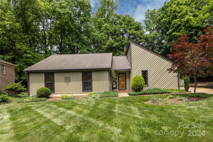 Charming ranch on a gorgeously landscaped level lot in a cul de sac! This light-filled home has wood floors, a neutral interior, vaulted ceilings in the kitchen & dining area, vinyl Low-E windows, and a lovely family room with a fireplace. The kitchen w/ a soaring ceiling was renovated in 2007 & features extensive custom cabinetry, granite counters, a breakfast bar, a tile backsplash, & stainless steel appliances, while both a laundry/utility room & a walk-in pantry are just off the kitchen. A primary suite w/ dual closets boasts an en suite bath w/ granite countertop & a tile shower w/ frameless glass door.  Two spacious secondary bedrooms are bright & neutral & share an updated bath with a tub/shower w/ tile surround. A door off the dining area leads to a large deck overlooking the fabulous backyard w/ an adorable shed.  Not to be missed: an attached workshop w/ exterior door access & the irrigation system which waters the beautiful lot! In south Charlotte & close to Matthews too!