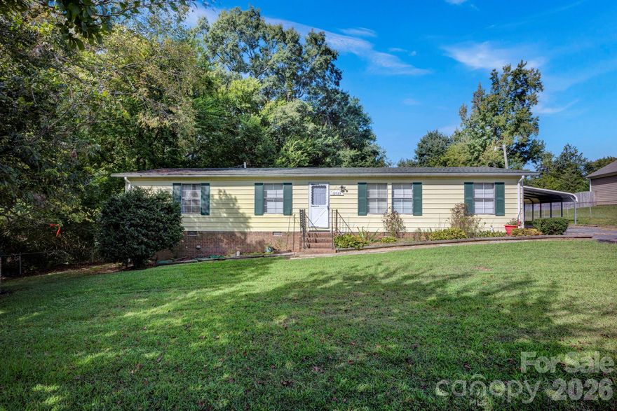 Great opportunity to own over half an acre on the east side of Huntersville, a popular, growing area that is convenient to Huntersville Town Center, Birkdale Village, and only 8 miles to Concord Mills and 4 miles to I-485.  This property offers a 3 bedroom, 2 bathroom doublewide manufactured home, with a metal 2-car carport.  Bring the pets to the fenced-in yard; ready to move in. Great opportunity for investors as well.
Property being sold as is; seller will make no repairs.