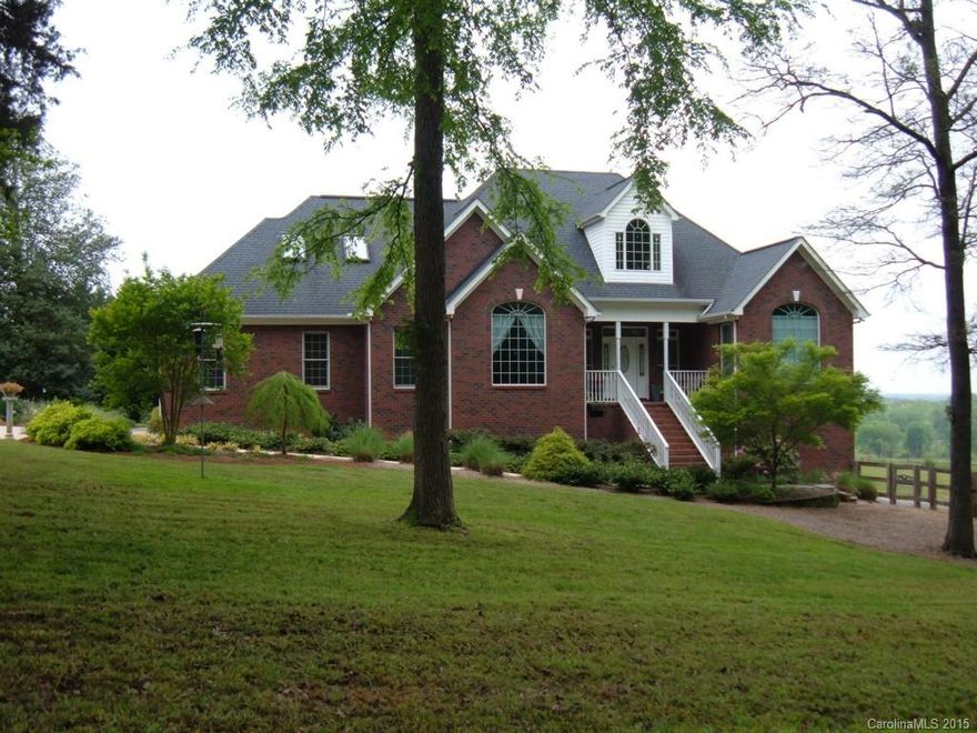 Beautiful brick custom home on 3.79 serene acres!  Features a chef’s kit w/granite counters, lg break area, form DR, GR w/vault ceiling & built-in's, huge sunrm for relaxing, lg master w/tray ceiling, soaking tub in master BA, & two secondary bedrooms + bonus rm.  Home has huge basement workshop, addl' garage, & tons of storage.  1yr warranty included. Enjoy the gorgeous landscaping when you stroll over the grounds. Fenced in yard just perfect for your pets. This home is a true hidden treasure!