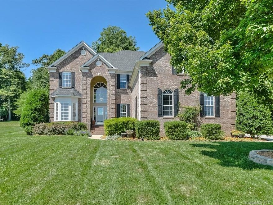 Attractive 2 story home located across the street from your deeded boat slip and community pool.  Great Lake access home features 4 bedrooms with the master suite located on the 2nd floor. Wonderful built ins and extensive natural light in this beautiful home - enjoy the amazing outdoor covered entertaining living space with wood burning fireplace for the wonderful Carolina evenings -