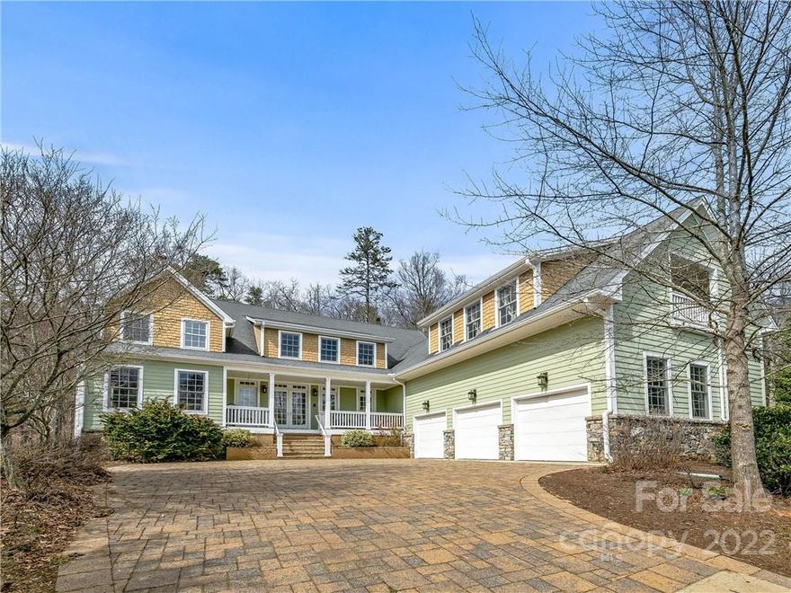 Originally crafted as the developer's personal residence, this exceptional home is perfectly positioned walking distance to Biltmore Park Town Square. The main floor feaures a 2 story great room with stone fireplace, cooks kitchen, elegant primary suite, formal dining, private study, functional laundry room, spacious 3 car garage, and abundant natural light. Upstairs offers flexible room arrangements with 4 bedrooms connected by full baths, along with a second primary suite with a second laundry and private outdoor terrace. The walk out basement features a rec room, bedroom, full bathroom, and a sizable storage/mech room. Quality finishes include tongue and groove ceilings, reclaimed heart pine flooring, floor to ceiling windows, high-end appliances, multizone HVAC, whole house water filtration, and a custom stonework motor court. Enjoy quality time spent outdoors on this private lot with mountain views, and a protected setting bordering the Ramble and a hardwood forest in the rear.