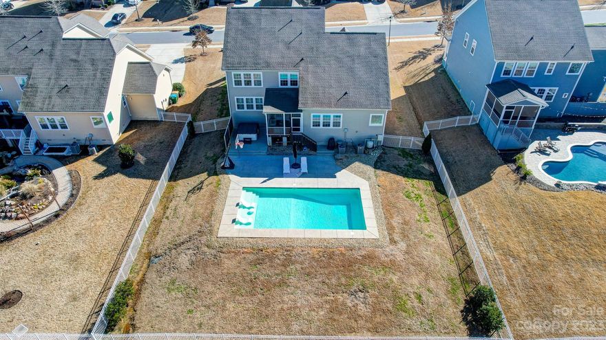 Lawson's finest! Custom-like owner upgraded Jamison by Lennar with in-ground POOL. Meticulously maintained, move-in ready. Boasts upgrades including gorgeous 6" hardwood floors, custom office built-ins and barn doors, plantation shutters, crown moulding, lighting, paint, carpet, shiplap and bead board accents, wood stair risers, penny tile flooring, drop zone PLUS stunning renovated master bath with herringbone marble flooring, frameless glass shower, and free standing soaker tub + enormous walk-in closet with custom organizers. Luxurious, open floor plan perfect for family and entertaining. Spacious master is on main with 3 true secondary bedrooms up. Huge bonus or 5th bedroom option. Enjoy the fabulous NC weather from your screened back porch with custom swing overlooking in-ground 18x36 saltwater pool plus 6 person Catalina luxury hot tub. Fenced yard with wooded views. Lawson is a wonderful family-friendly community with resort-style amenities. Award-winning Cuthbertson Schools.