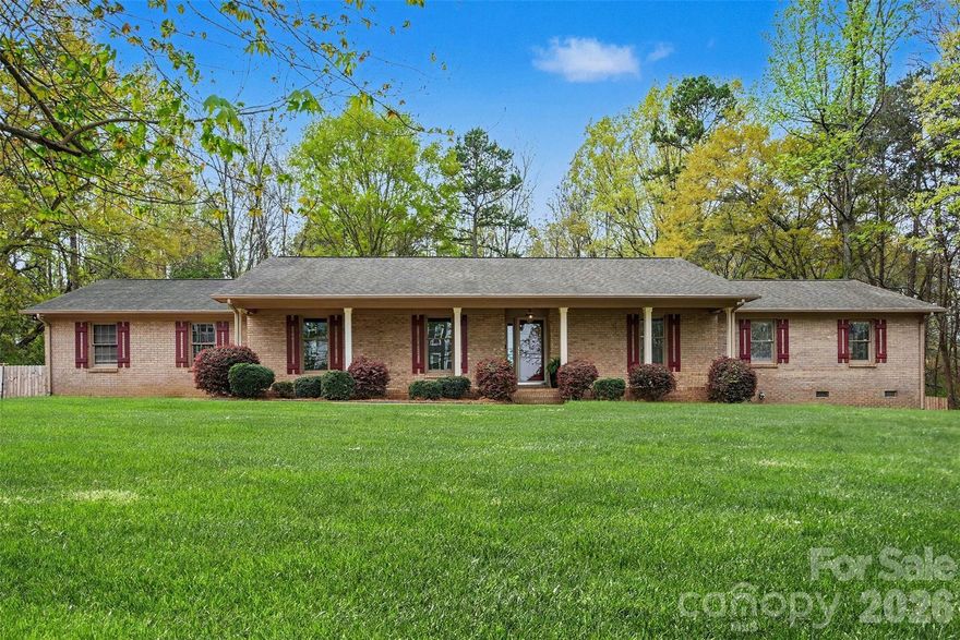 Welcome home to this custom-built brick ranch on a private half-acre lot. This 3-bedroom, 2-bath home offers comfortable living with thoughtful updates throughout. Inside, you will find a large great room with a vaulted ceiling and a stunning floor-to-ceiling brick fireplace. Step outside to the spacious deck overlooking the fenced backyard, perfect for quiet evenings or entertaining guests.

An oversized bonus room with French doors is currently set up as an office and offers excellent flexible living space. Recent improvements totaling more than $50,000 include a primary shower renovation, new engineered hardwood floors, a full crawlspace overhaul and a brand-new HVAC system.

Enjoy a great location near I-485, Hwy. 16 and Mountain Island Lake, just 15 minutes from the airport and uptown Charlotte. Best of all, there is no HOA.