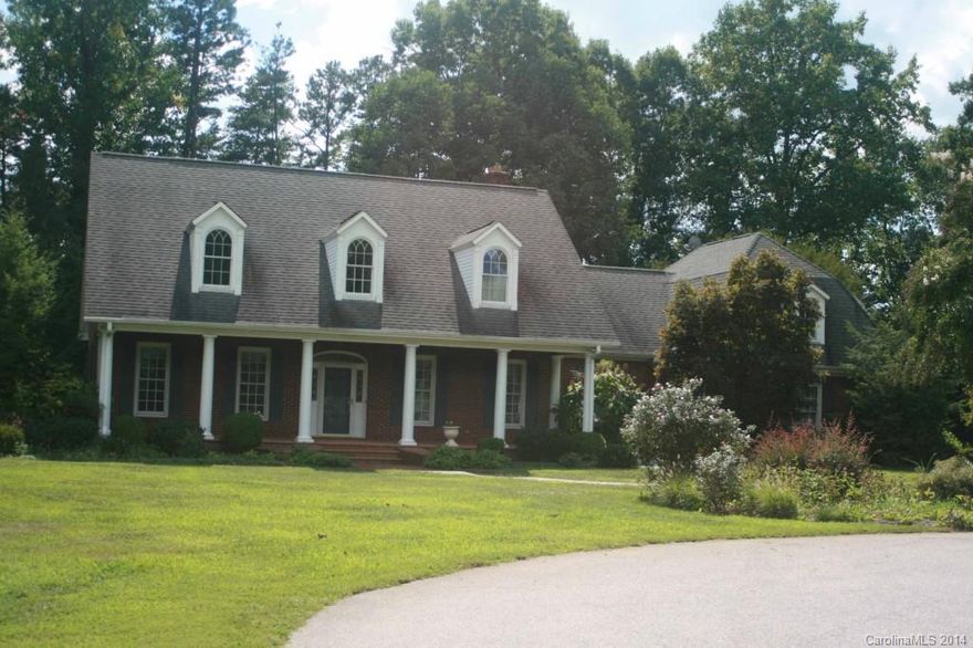 One Owner Custom Built Home. Corian Counters, Custom Cabinets, Hardwoods, Custom Moldings. Fireplace in Den & Kitchen!! . Luxury Master Suite. Two Laundries!!  Fifth Bedroom can be Private MIL Suite, Guest Room or Bonus Room. Brick Porch & Terrace w/ Retractable Awning. Bike garage plus Brick Workshop w/ Power & Woodstove. Private Natural Setting. Too Much Detail to Mention. Close to City Limits but Only Subject to County Taxes :)