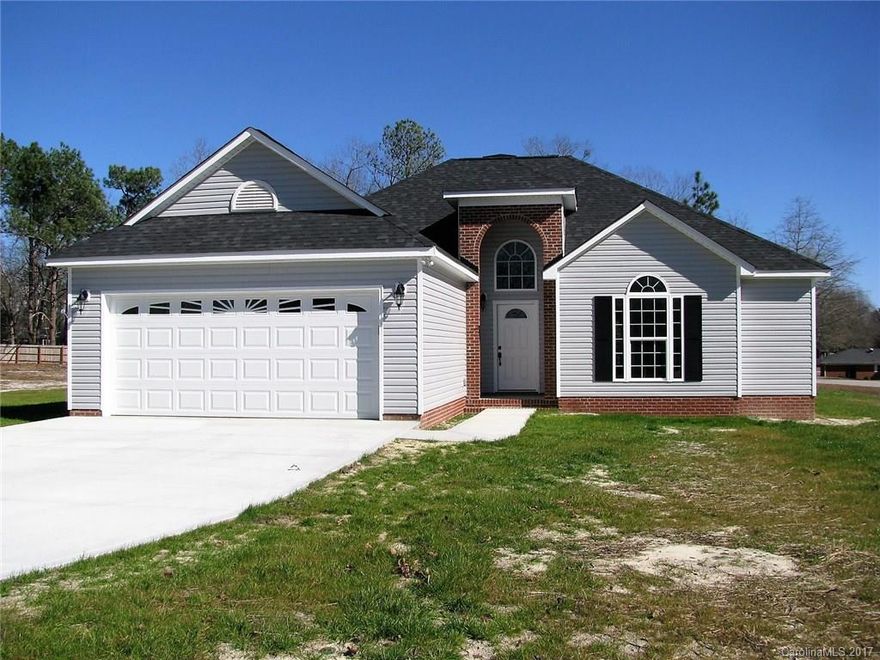 A new home with the finest appointments - stainless steel appliances, granite counter tops throughout, hardwood floors in foyer, family room, dining area, tile in kitchen, and baths. Ten foot ceilings and an open floor plan with views to a concrete patio and a corner lot! Bring your flat screen TV for the already wired location And, oh, the closet space!! Walk-in closets in all three bedrooms with two in the master bedroom bath. Lawn is seeded with winter and summer grass. Beautiful Home!!