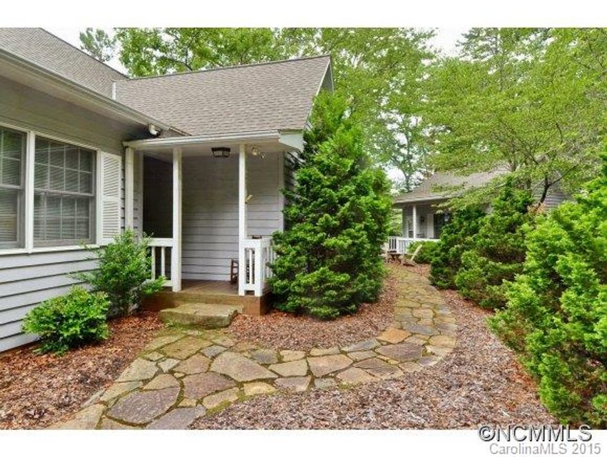 BIG MOUNTAIN VIEWS from this 2BR/2BA mountain home, PLUS ARTIST or IN-LAW cottage. 27 ft solarium overlooks mountain landscape. Large master BR, beautiful hdwd floors, open floor plan, built-ins, scrnd porch, deck. New roof 2007. Nature Lover's paradise. A rare 1BR 1BA cottage just steps from main house. All this in city limits in Deerlake Village. Pool, lake,clubhse,trails. Not many like this!