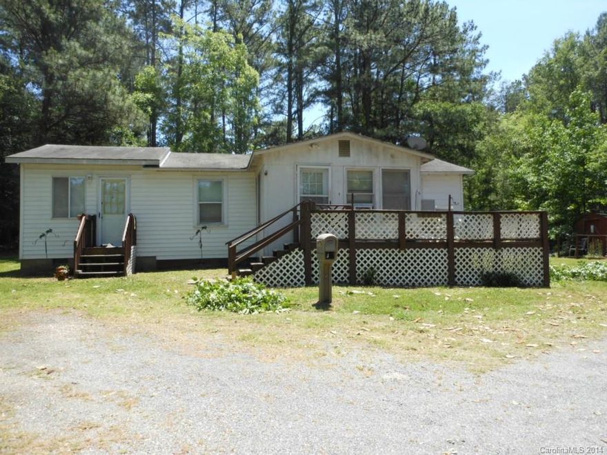 Great Frontage property on Gold Hill Road.  1 acre lot with old home that is a fixer upper !!! The lot is flat and the location is great.  House and Garage sold AS IS.  No repairs to be made by the seller.