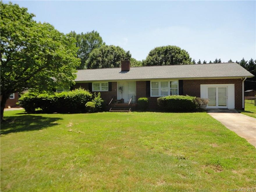 Brick Ranch on a large lot in a great location! Features include hardwood floors, sun room, large lot, fence. Shop is 16x20.