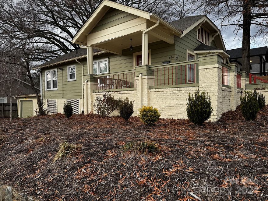 DOWNTOWN LENOIR! Adorable 2 bedroom, 1.5 bath bungalow within walking distance to shops, school, banks, hospital, park, walking trails & more! This charming 1950's home has all the character you would expect including arched doorway, hardwood floors, spacious rooms, etc; but with all the conveniences of modern luxury. A dreamy kitchen features custom cabinetry, a pantry with several floating shelves to slide in & out to access staples...desirable granite counter tops, farmhouse sink & high-end appliances! A substantial size dining room flows from the kitchen for entertaining, & from there, a lovely living room with bay windows. The bedrooms are perfect with a gorgeously updated bathroom in between. Also, on the main level is another 1/2 bath & laundry room, so no treading up & down stairs! Window replacements throughout home. Walk up attic for storage. Basement has finished room, plus single garage & more storage. Wide porches for relaxing. Handicap access. Desirable Davenport School!