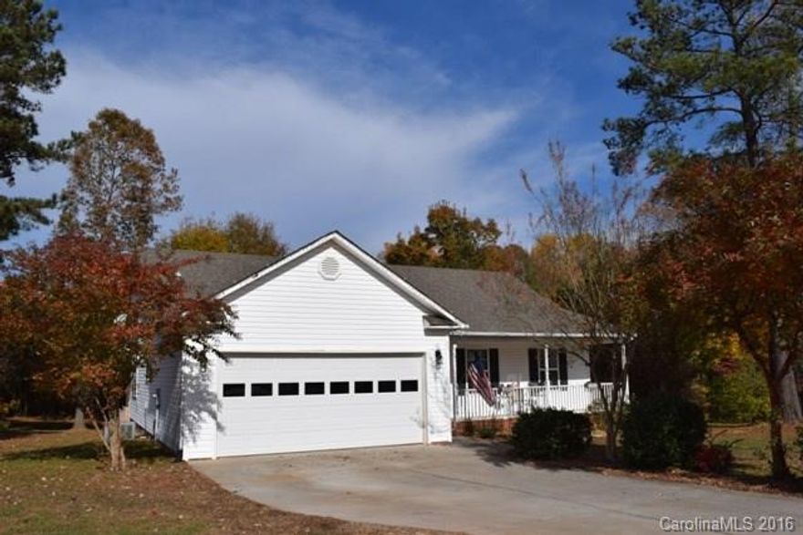 Cute as can be and it will not last long!  Large lot, fenced back yard.  Property line goes well behind the fence where there is a firepit!  Great room has a fireplace/gas logs, spacious kitchen with stainless appliances.  Three bedrooms and two full baths.  Double garage, rocking chair front porch. New roof in 2012.  Great location in the cul-de-sac!