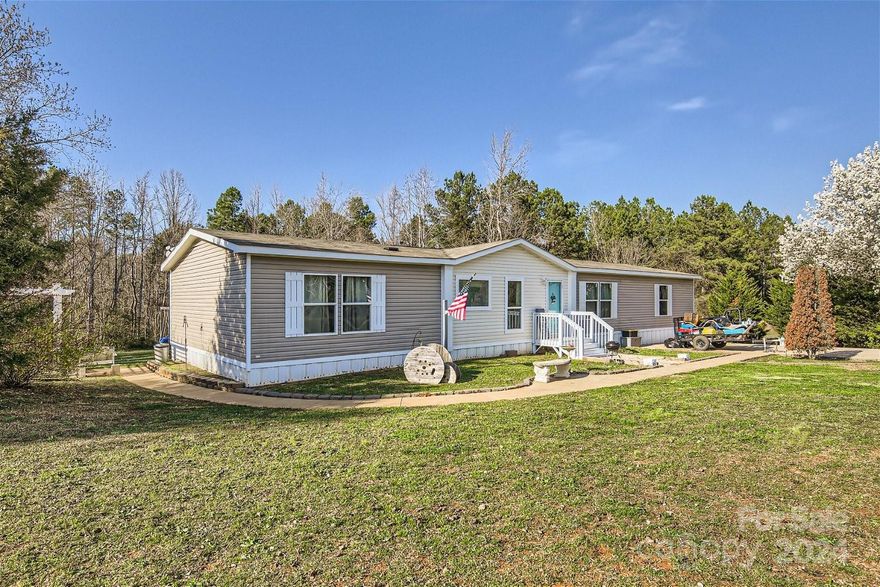 This beautiful home in Lancaster is truly a must see! A spacious open floor plan provides for seamless flow between the kitchen, dining area and two living room spaces. This layout provides ample room for entertaining, while the split bedroom floor plan also provides for quiet and relaxation. The primary bedroom suite offers a walk in closet, dual vanity & large garden tub. A generous 2nd full bath also boasts two additional vanities conveniently accessible to the 3 additional bedrooms. The home provides tons of storage space including walk-in closets, a large Laundry/ mud room as well as an impressive walk in pantry. Outside you will find a private 1.51 acre lot offering a large concrete patio w/ pergola and two small storage sheds. Sellers are offering up to $1,500 in flex credits with acceptable offer that could be used for closing costs, rate buy-down, or anything desired!  All in a great school district just minutes from both Indian Land & Lancaster! Schedule your showing today!