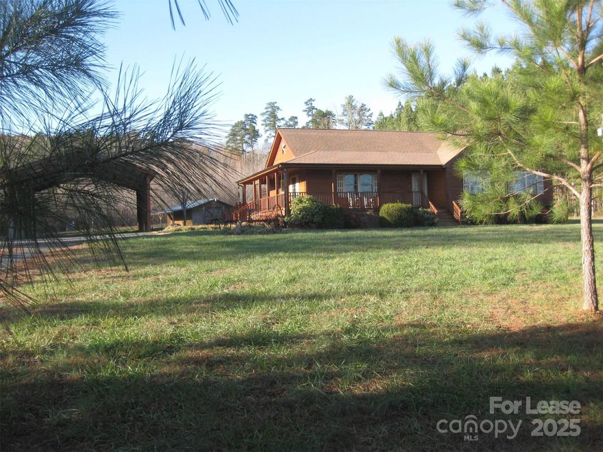 This home is nestled in the quiet country off the scenic byway of Morrow Mountain State Park. The home boasts large rooms, a wrap around covered porch, huge yard, garage shop and an R/V size carport. Background check/Credit Report is required.  An application must be filled out before viewing the home. No Pets/No Smoking