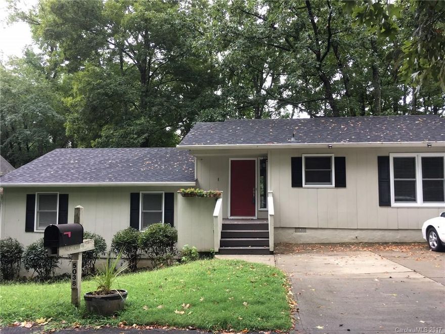 Beautiful split level on the golf course in Tega Cay! Enjoy golf course and water view from the deck! Gorgeous gas stone fireplace!