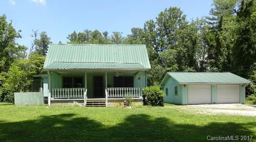 Well located early 1900's farm house.  Spacious living room, some original wood flooring, kitchen opens to side screened porch + covered front porch, floored attic storage.  Detached two car garage.  Beautiful, open, level 1.9 acres - portion is in the flood plain.  Has much potential!
