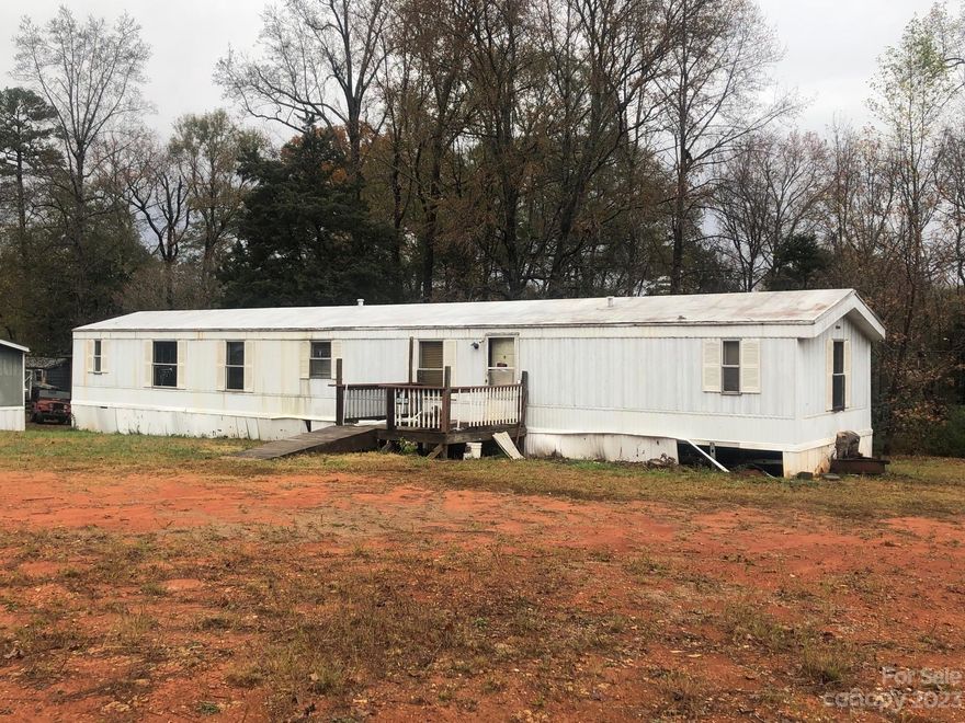Investor opportunity...  This lot comes with a 3/2 manufactured home that needs a complete remodel but priced accordingly.  Cash offers only. Property is being sold as-is.