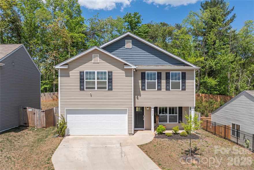 First time on the market since new construction, this beautifully maintained home showcases the well-designed Vivian plan, maximizing every square foot with comfort and style. Offering 3 bedrooms and 2.5 baths, the layout features granite countertops, shaker-style cabinets, a spacious pantry, and Mohawk wood-look flooring throughout the main level.
The inviting den is anchored by a cozy fireplace (ready for connection with a fuel tank), perfect for cool evenings, while a decorative accent wall adds a custom touch. The kitchen is enhanced with upgraded appliances and a modern upgraded faucet, complementing the Whirlpool stainless steel stove, microwave, and dishwasher.
Upstairs, the generously sized owner’s suite includes a large walk-in closet and a spa-like bath with a 5-foot walk-in shower with glass enclosure and double sinks. Secondary bedrooms and bonus space provide flexibility for guests, office space, or hobbies.
Enjoy mountain views, including a sightline toward Mount Pisgah, from this desirable setting. Step outside to a private, fenced-in backyard—ideal for relaxing, entertaining, or pets.
Original Home package includes a programmable thermostat, security system pre-wire, video doorbell, and Amazon Echo and Echo Dot for added convenience. A 370 sq. ft. garage completes this exceptional home.
A rare opportunity to own a thoughtfully upgraded, move-in-ready home with scenic views in Candler.