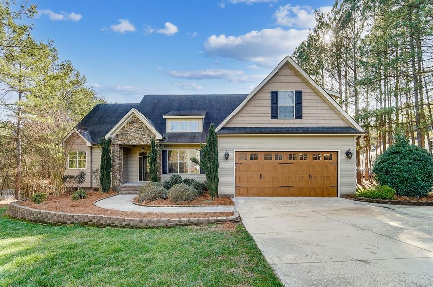 Gorgeous 4 BR home with quality finishes, mature landscaping, & spacious fenced yard! This home has everything you're looking for from a bright & open floor plan, gorgeous hardwood flooring, rich molding, & vaulted ceiling. You’ll love the light filled great room featuring a stunning floor to ceiling fireplace opening to dream kitchen. Engage your inner chef in the amazing kitchen offering granite counters, ss appliances, gas range, breakfast bar & dining area. Off the kitchen is a flex space perfect for formal dinning or office with French doors. Main level primary suite has tray ceiling, 2 walk-in closet, & bath w/ dual vanities, whirlpool tub & walk-in shower. Upper level boasts a huge bedroom plus full bath. Linger over morning coffee, read a book, or relax & enjoy the outdoors from your spacious screened porch or grill & entertain from the deck overlooking the private fenced backyard. Great location convenient to shopping and restaurants!  Low SC taxes!