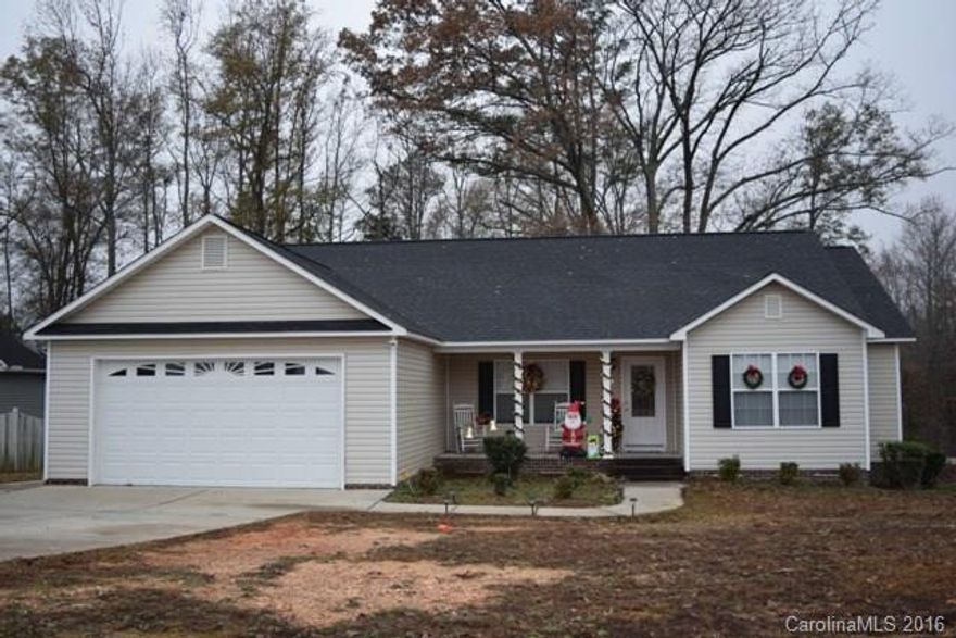 Cute as can be!  Large kitchen and eating area, spacious great room.  Vaulted ceiling in master bedroom.  Master bath has double vanities, garden tub and separate shower.  All bedrooms have walk-in closets.  Double garage, deck, corner lot, over half acre lot.