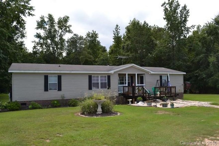 What a beautiful piece of property! Gorgeous setting. There is also a single wide on the property that could be used as a rental, etc. Tax # is 101-00-00-105. Both homes feature 3 bedrooms, 2 baths & a split bedroom plan. There is a man made pond, 30 pecan trees as well as apple and pear trees & grapevines. Awesome playhouse for the kids. Wonderful for 4 wheeling, gardening, farm animals. You can not have is pigs!  What an great setting to raise your family! BA should verify schools. AS IS SALE.