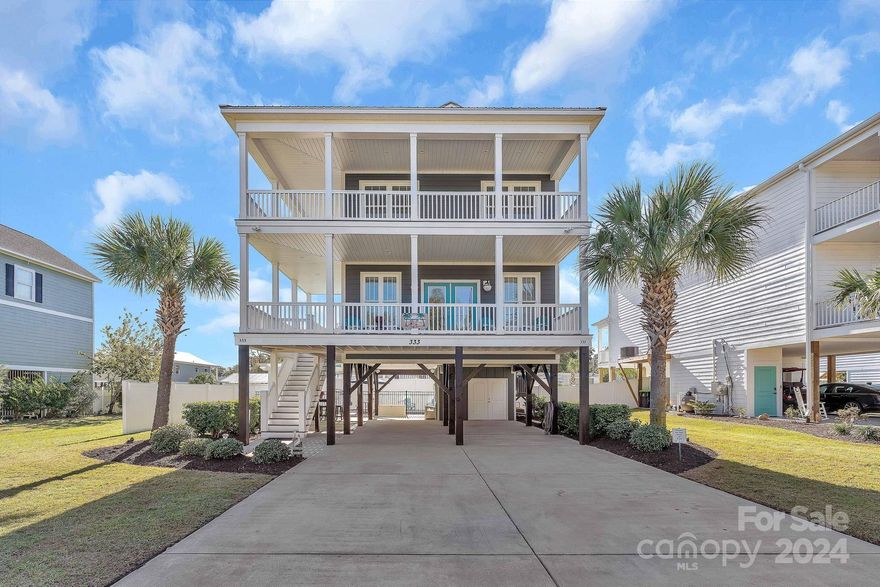 Absolutely stunning raised beach house located in Garden City, SC. Approx. 2 blocks back from the ocean with public access located at the end of street. Less than 10 minutes to Murrells Inlet Marshwalk and all the year-round entertainment. NO HOA or leased lot. Meticulously maintained and in like new condition. This gorgeous home offers 4 bedrooms and 3.5 baths. 1 queen primary with en suite on main level and 1 king primary with en suite on upper level. 2 additonal bedrooms on upper level sharing a full hall bath. Laundry located on upper level in the hall. Lots of storage including owners closets and golf cart storage. This home has great entertaining options with attached pergola, outdoor speakers, outdoor island for gathering, propane grill and inground pool. House comes completely furnished including all kitchen appliances. Whether you are looking for an investment with great rental history or a permanent residence, this is your opportunity to own a true slice of heaven!!