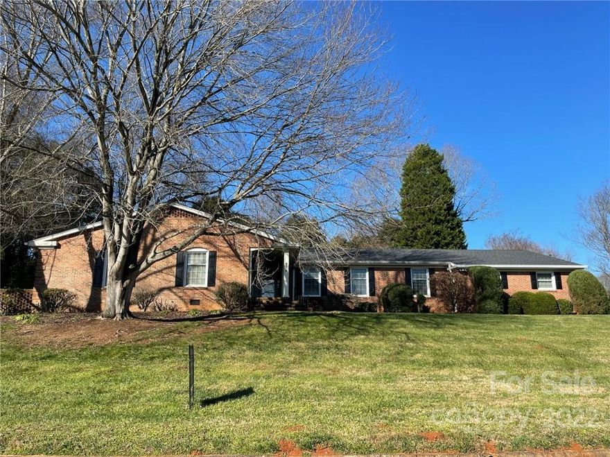 Just off Hwy 74 near charming downtown Gastonia, NC you'll find this sprawling, 4 bedroom, 3 bathroom custom ranch home. Nestled on two homesites, this beauty provides plenty of privacy and space. Every room features large closets and ensuite bathrooms. An inviting sunroom, hidden pantry, and multiple family rooms make this home unique and sought after. There are plenty of shops and restaurants near by, as well as easy access to Hwy 74 and I-85. This home features a 2 year old roof!